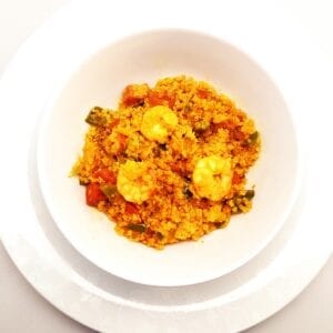 Chorizo, prawn and pepper quinoa paella in a bowl