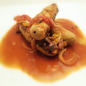three sausages in tomato sauce