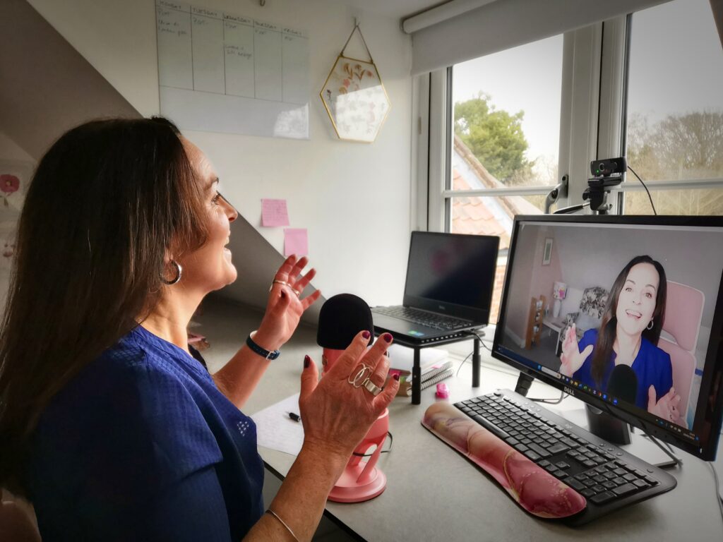 Natasha at her desk broadcasting to Zoom